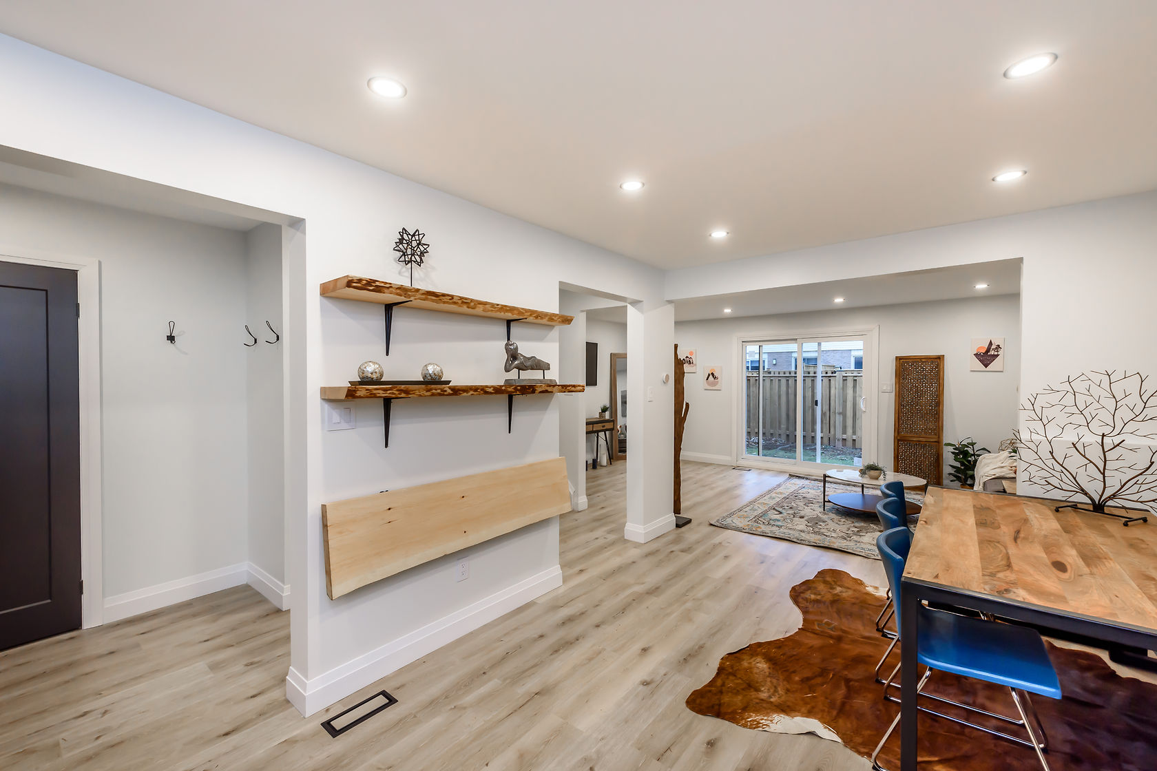 Bright finished basement with warm wood accents and clean modern design — excellent portfolio shot — Gateshead, Hamilton | MTC Renovations